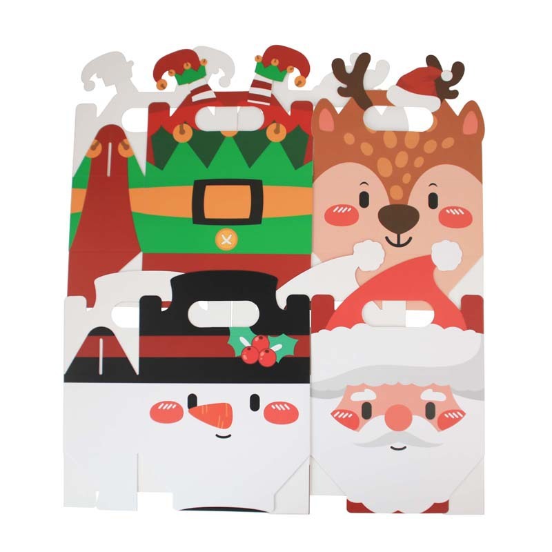 クリスマスシリーズのキャンディー箱クリスマスの新しい四角いプレゼント箱クリスマスの手にビスケットケーキの洋菓子箱を持っている|undefined