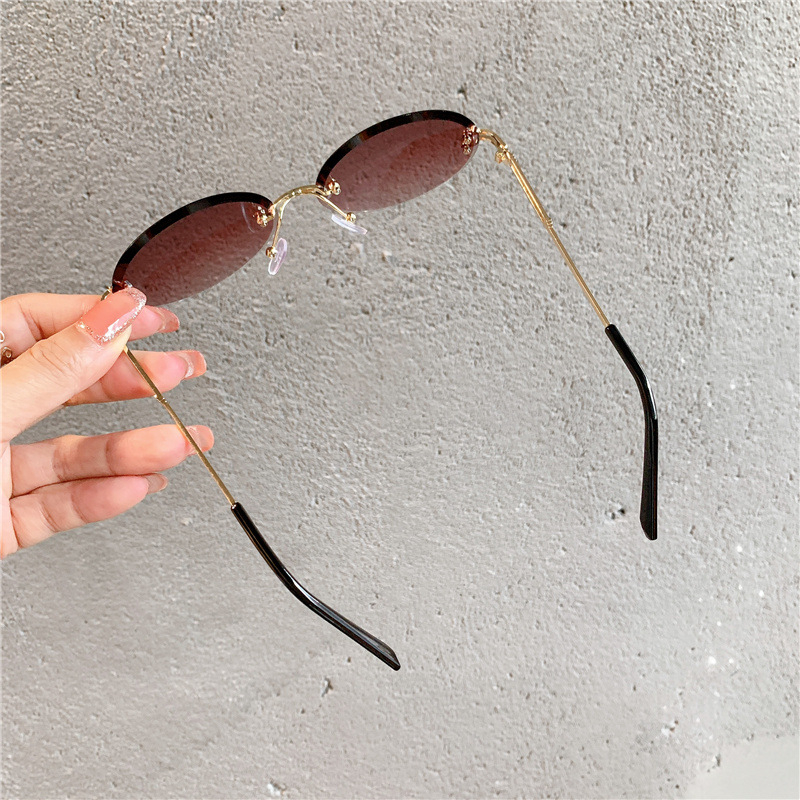 Nuevas gafas de sol transfronterizas para mujer, gafas de sol con degradado rojo ovalado en red, sin marco, gafas de moda al por mayor_voghion.com