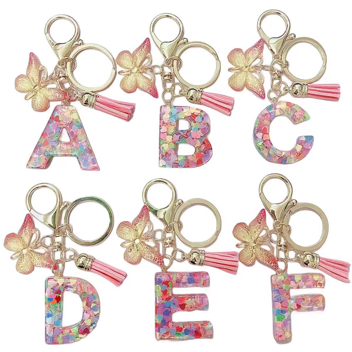 New cross-border resin English letters epoxy jewelry European and American popular butterfly ornaments love sequins keychain