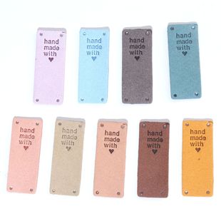 Spot color label handmade letters folded in half embossed suede leather logo hat handmade bag children's clothing
