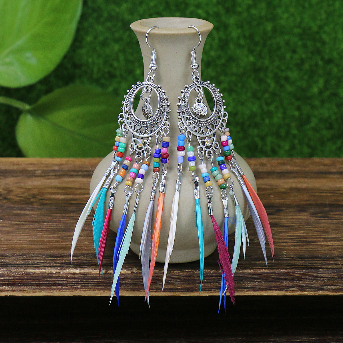 Hanqi jewelry European and American personality exaggerated hollow bohemian colorful rice beads feather tassel earrings