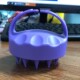 Purple shampoo brush with short teeth