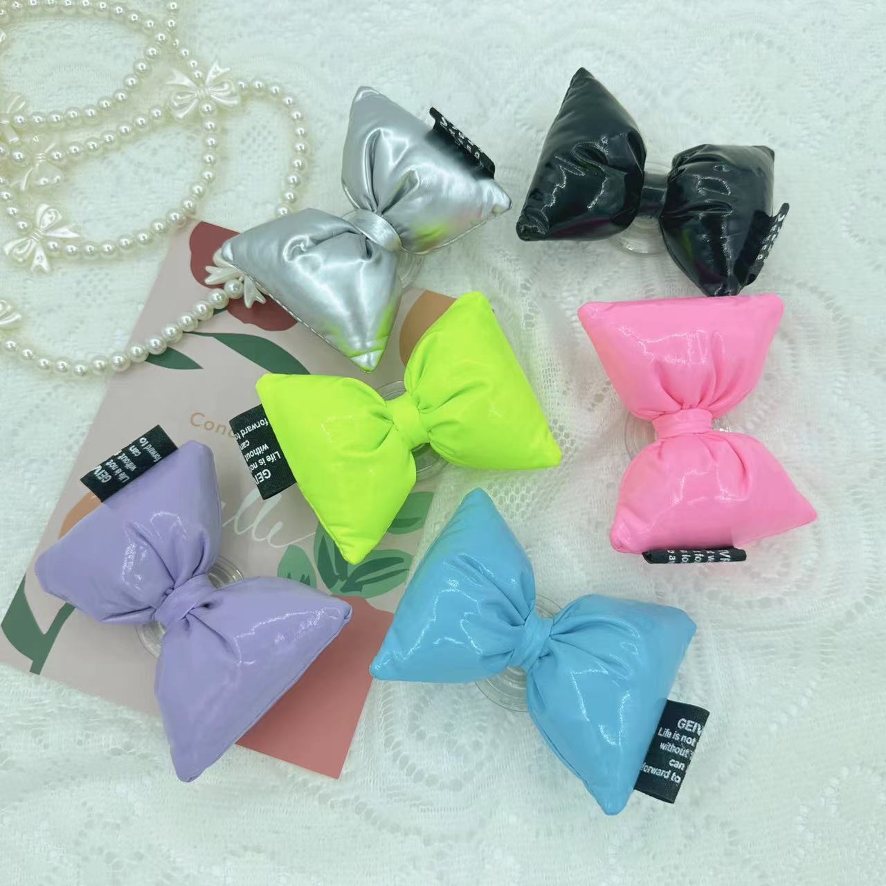 Korea ins leather girl bow mobile phone air cushion holder plush bow tie retractable desktop stand wholesale