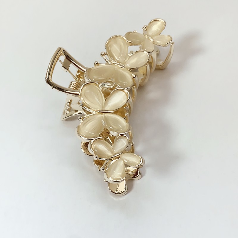 Νέο γυναικείο κλιπ υψηλής αίσθησης 2023 Καλοκαιρινό γατίσιο μάτι πεταλούδα κεφαλιού καρχαρία Κλιπ μαλλιών με κλιπ κεφαλής_voghion.com