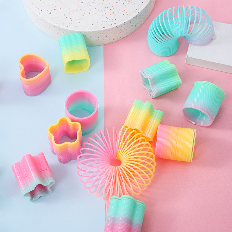 Factory Direct Sales small size magic rainbow circle student educational toys mini shaped spring ring night market stall supply