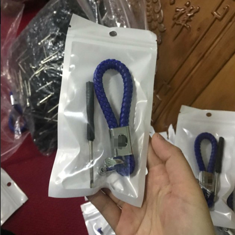 Creative cute hand-woven leather rope big head key chain PU men and women car key chain car logo gift