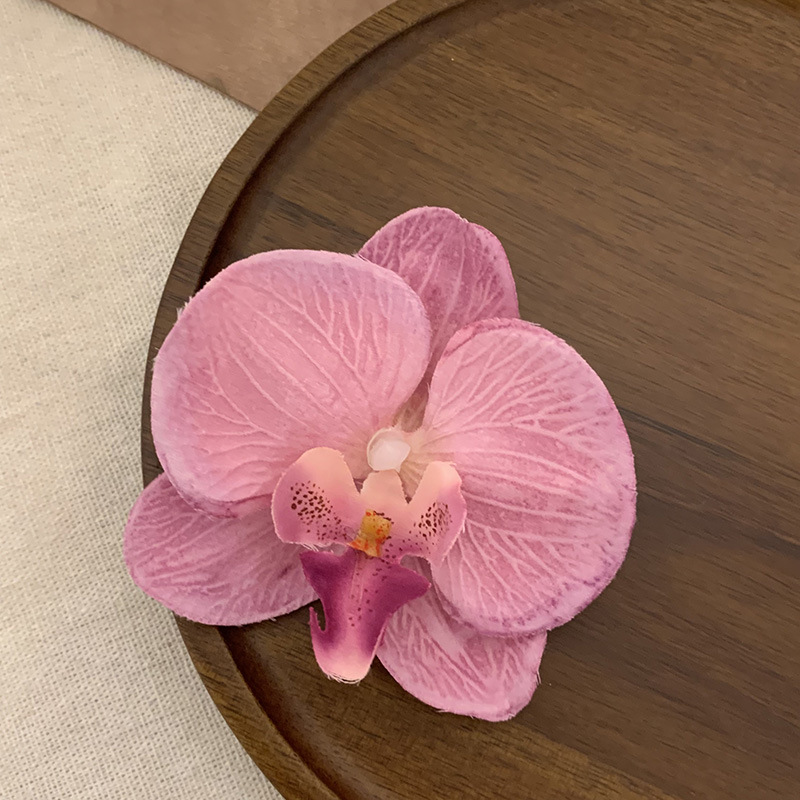 Wearing flower phalaenopsis side clip hairpin in this world, atmosphere feeling, photo, hair clip, seaside holiday hair accessories, headdress_voghion.com