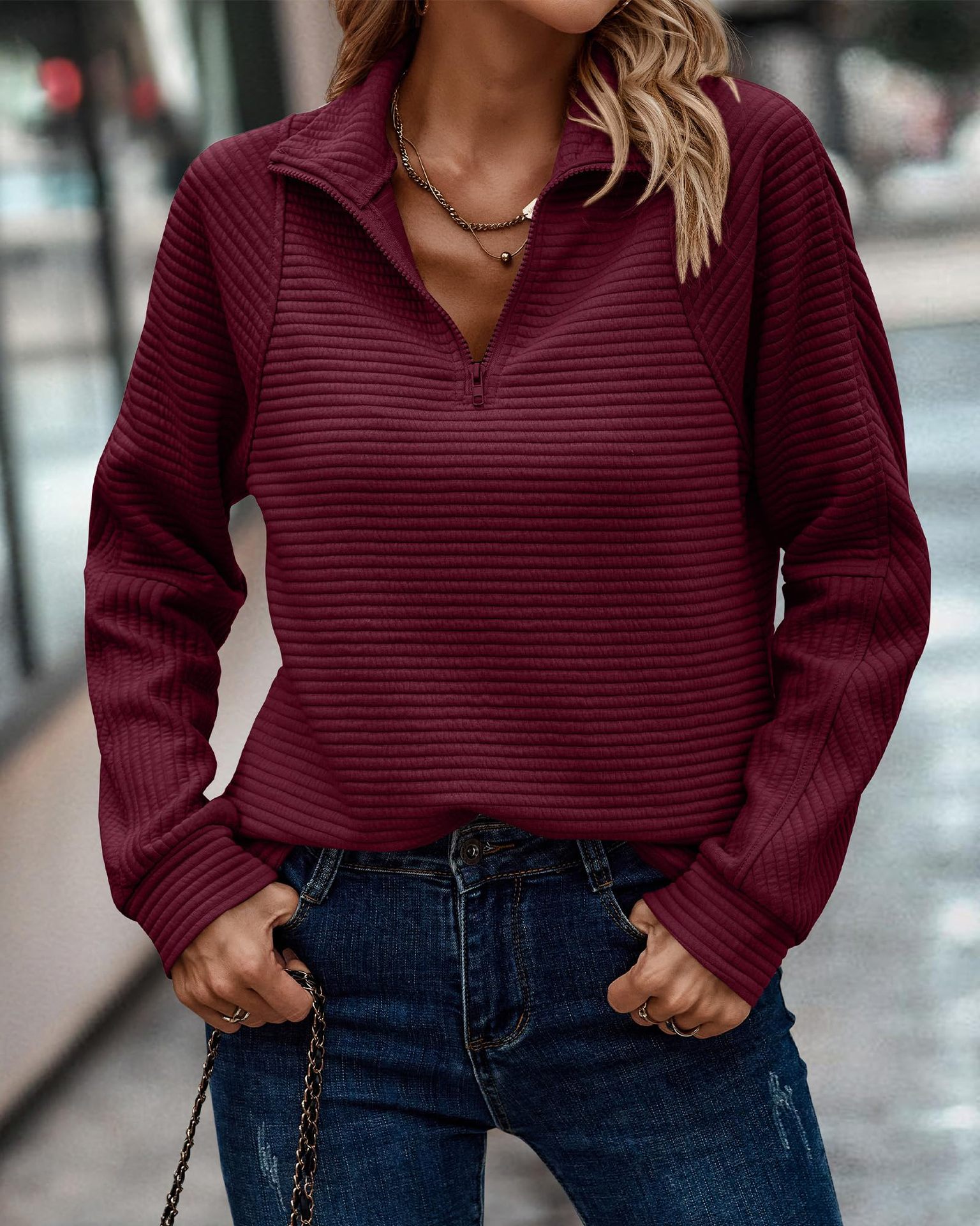 2023 European and American autumn popular comfortable loose snake bone pattern solid color stand collar zipper long sleeve stitching women's sweater