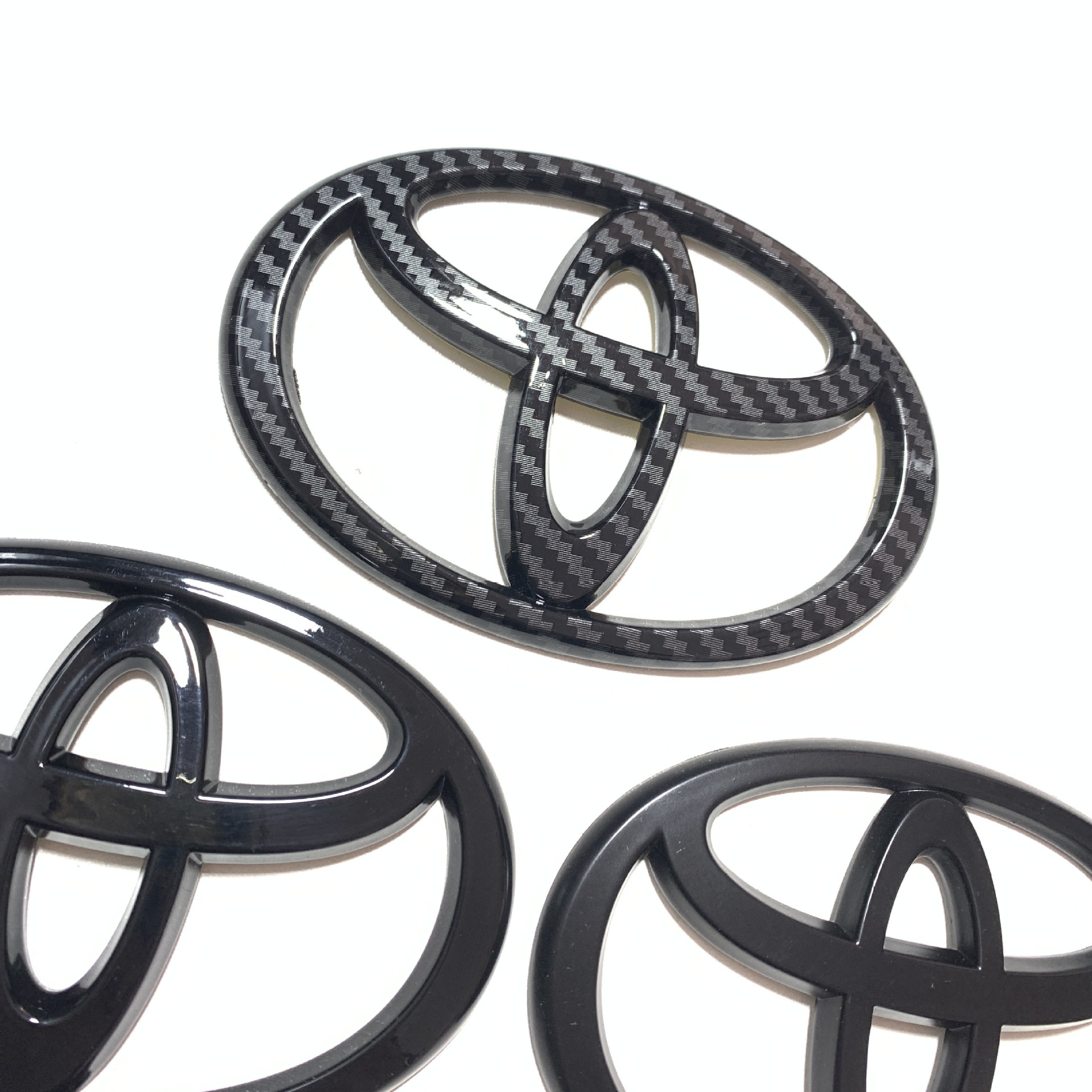 Suitable for Toyota front and rear car logo Camry Crown Ruizhi Garland Vichi Highlander Carola steering wheel car