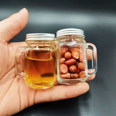 Factory direct mini handle cup glass bottle sealed jar Jam bottle with lid Autumn pear paste Honey coffee seasoning bottle