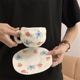 Retro red and blue rose cup and saucer