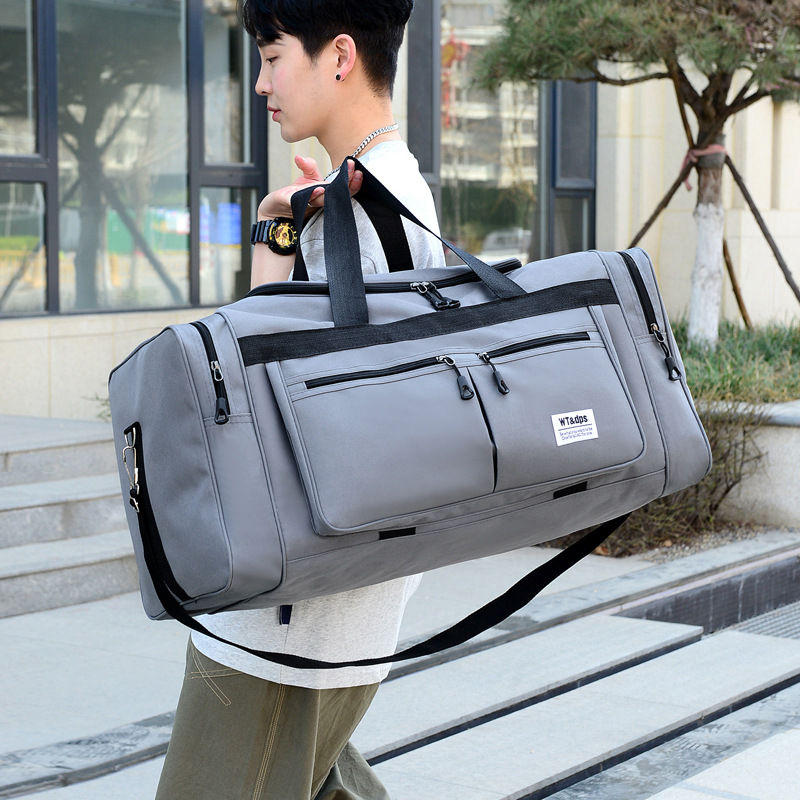 New large capacity foldable portable travel bag male and female students long and short distance travel luggage bag waterproof wholesale