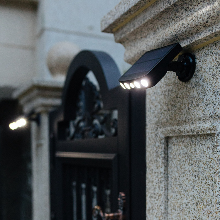 Cross-border new LED solar wall lamp courtyard garden waterproof lighting imitation monitoring spotlight human body induction street light
