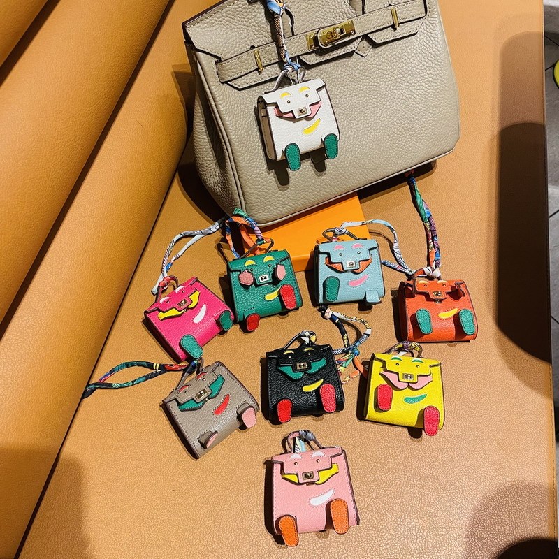 H家の同じタイプのminiキャリーの子供のカバンはかわいい怪獣のイヤーカバンの自動車のキーホルダーの車のペンダントを包みます。|undefined