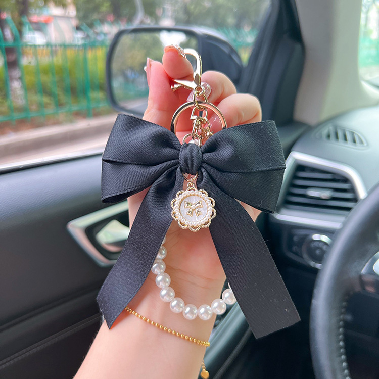 Creative bow pearl chain keychain women's fashion bag pendant car key chain personalized ribbon bow tie