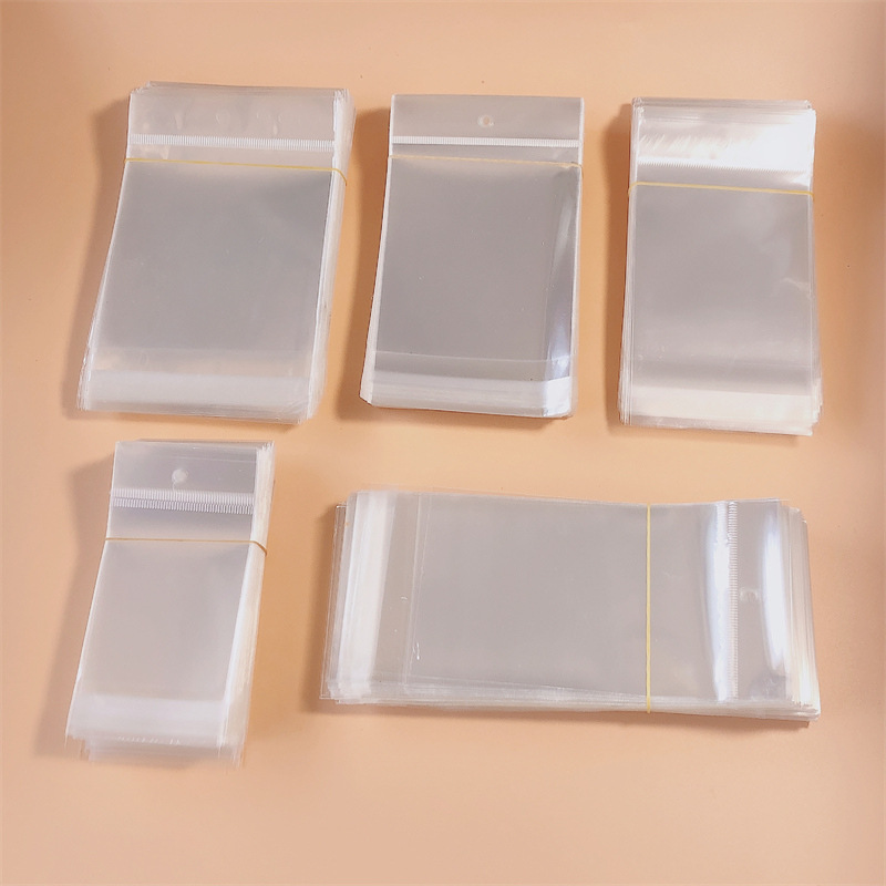Opp bag collection with hanging hole sticky transparent bag adult children hair accessories hair clip jewelry packaging accessories materials