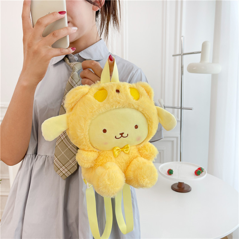 かわいいアニメのサンリオのぬいぐるみの公の子の包みの日本の倉庫の洛米は機械の人形のリュックサックの収納の小さい包みをつかみます|undefined