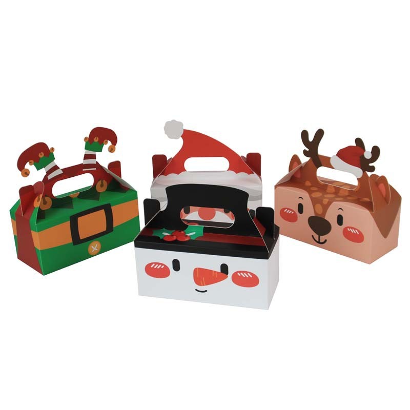 クリスマスシリーズのキャンディー箱クリスマスの新しい四角いプレゼント箱クリスマスの手にビスケットケーキの洋菓子箱を持っている|undefined