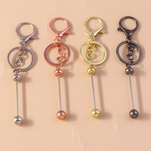 New European and American cross-border jewelry geometric round bead keychain personalized creative turn music alloy handmade pendant accessories