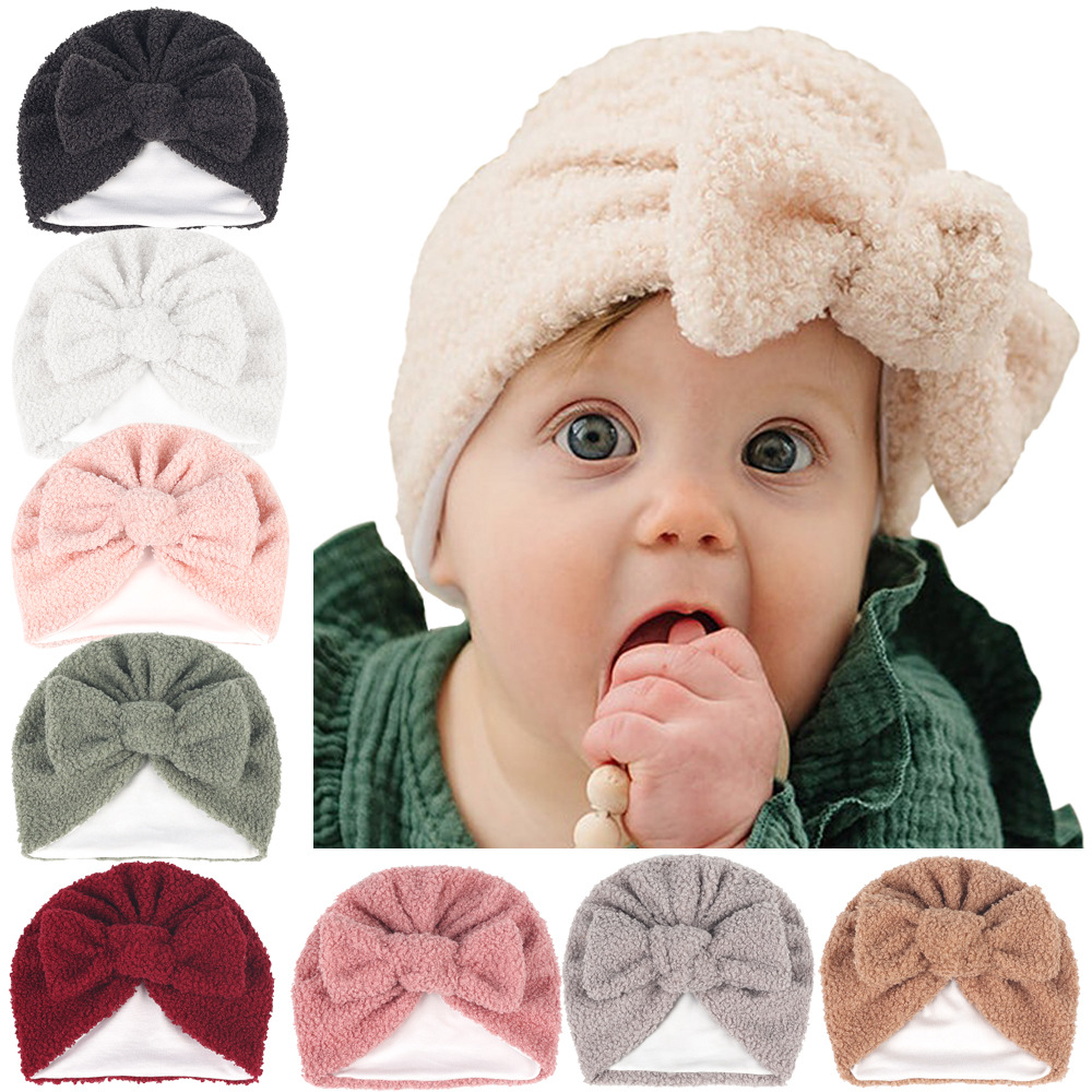 Wholesale European and American children's hats bowknot solid color teddy fleece hooded hat autumn and winter warm double-layer fleece thick hat 